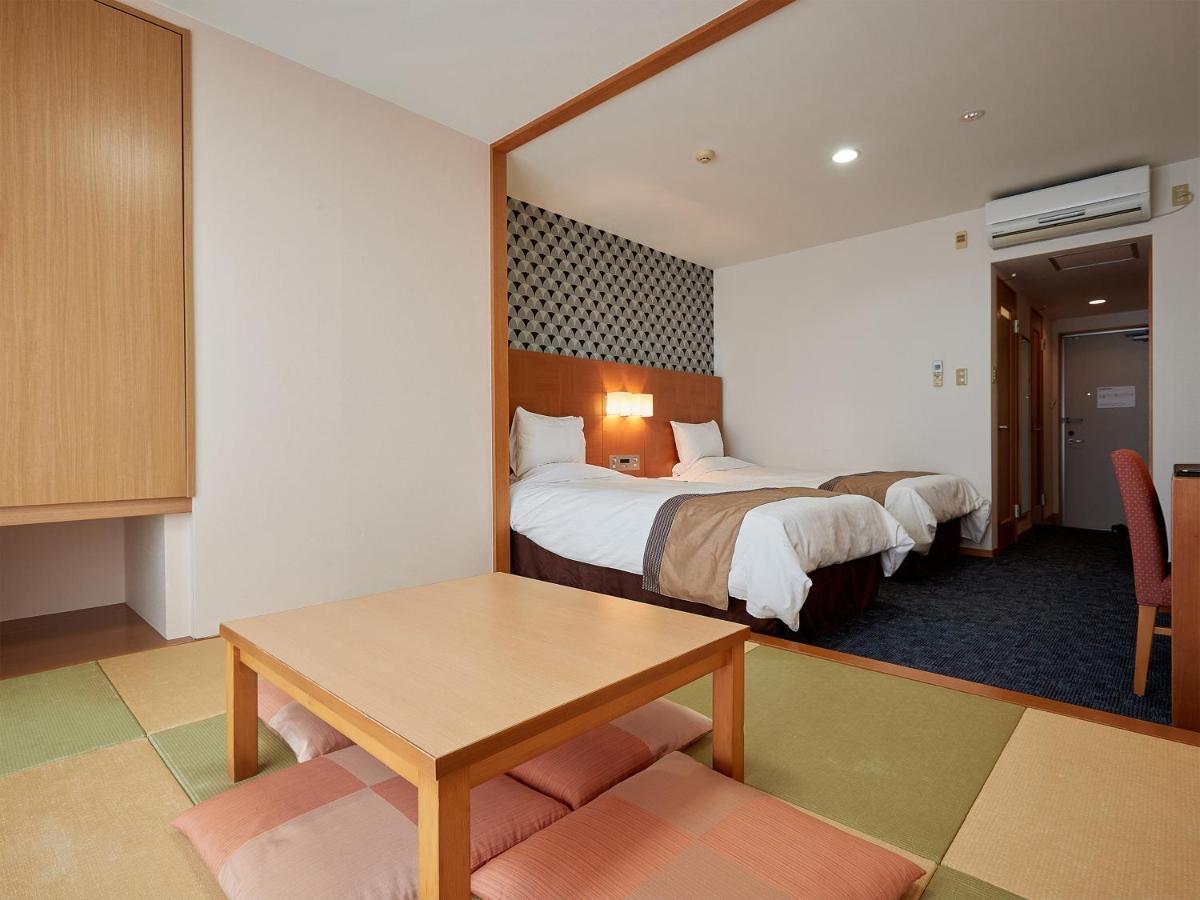 Hotel Murasakimura Yomitan Bagian luar foto