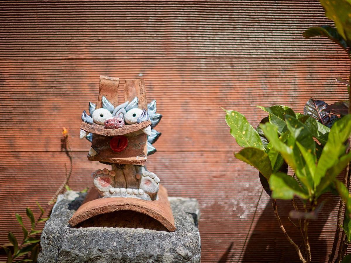Hotel Murasakimura Yomitan Bagian luar foto